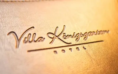 Ein Zertifikat, Auszeichnung, Logo oder anderes Dokument, das in der Unterkunft Hotel Villa Königsgarten ausgestellt ist