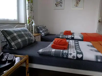 Ein Bett oder Betten in einem Zimmer der Unterkunft Ferienwohnungen wie im Süden Großostheim