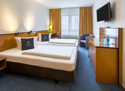 Ein Bett oder Betten in einem Zimmer der Unterkunft Aspire Frankfurt Airport, Trademark Collection by Wyndham
