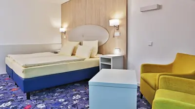 Ein Bett oder Betten in einem Zimmer der Unterkunft Hotel Zum Löwen