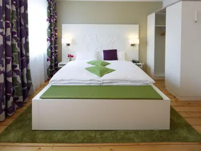Ein Bett oder Betten in einem Zimmer der Unterkunft Hotel Karolinger Hof