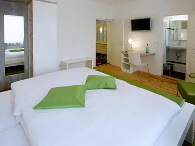 Ein Bett oder Betten in einem Zimmer der Unterkunft Hotel Karolinger Hof