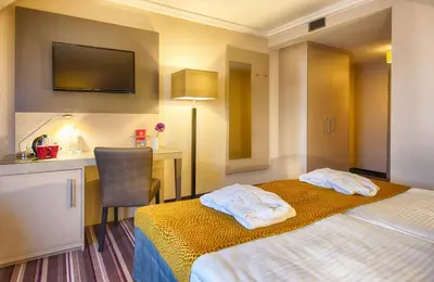 Ein Bett oder Betten in einem Zimmer der Unterkunft Leonardo Hotel Heidelberg Walldorf