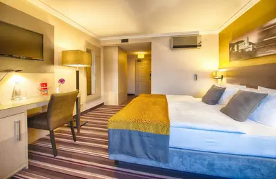 Ein Bett oder Betten in einem Zimmer der Unterkunft Leonardo Hotel Heidelberg Walldorf