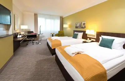 Ein Bett oder Betten in einem Zimmer der Unterkunft Leonardo Hotel Heidelberg Walldorf