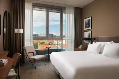Ein Bett oder Betten in einem Zimmer der Unterkunft NH Collection Heidelberg