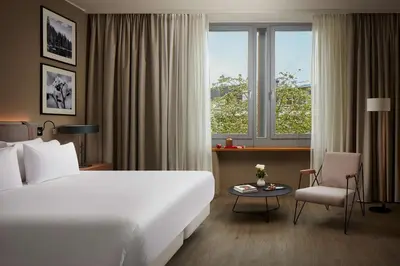Ein Bett oder Betten in einem Zimmer der Unterkunft NH Collection Heidelberg