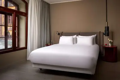 Ein Bett oder Betten in einem Zimmer der Unterkunft NH Collection Heidelberg