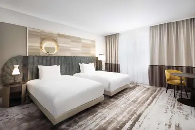 Ein Bett oder Betten in einem Zimmer der Unterkunft Hilton Heidelberg
