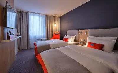 Ein Bett oder Betten in einem Zimmer der Unterkunft Holiday Inn Express Frankfurt Airport by IHG