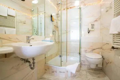 Ein Badezimmer in der Unterkunft AAAA Hotelwelt KÜBLER