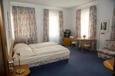 Ein Bett oder Betten in einem Zimmer der Unterkunft Hotel am Rathaus
