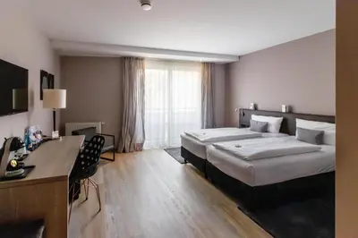 Ein Bett oder Betten in einem Zimmer der Unterkunft Best Western Plus Palatin Kongresshotel