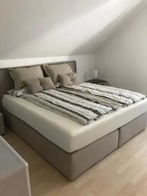 Ein Bett oder Betten in einem Zimmer der Unterkunft Ahorn 11
