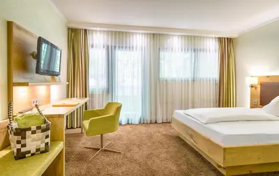Ein Bett oder Betten in einem Zimmer der Unterkunft Ringhotel Mönch`s Waldhotel