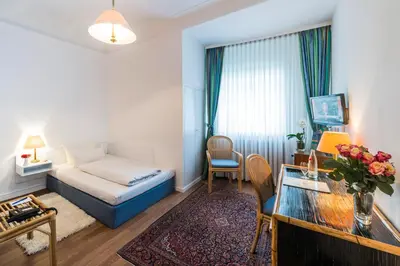 Ein Bett oder Betten in einem Zimmer der Unterkunft Parkhotel Atlantic