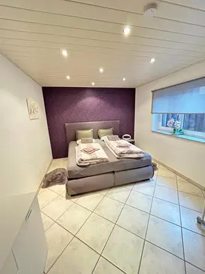 Ein Bett oder Betten in einem Zimmer der Unterkunft Wohnung Ahorn