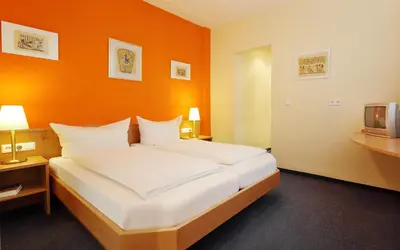 Ein Bett oder Betten in einem Zimmer der Unterkunft Hotel Zum Goldenen Mann