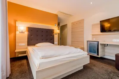 Ein Bett oder Betten in einem Zimmer der Unterkunft Hotel Bacchus