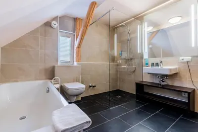 Ein Badezimmer in der Unterkunft Hotel Bacchus
