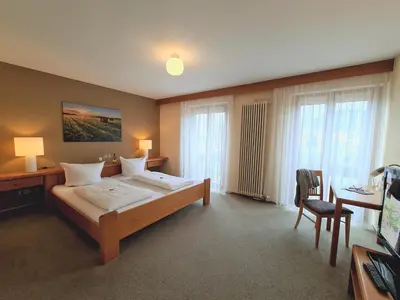 Ein Bett oder Betten in einem Zimmer der Unterkunft Hotel Goldenes Fass