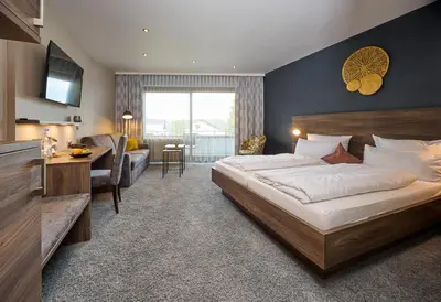 Ein Bett oder Betten in einem Zimmer der Unterkunft NaturKulturHotel Stumpf