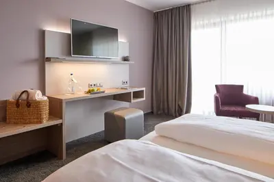 Ein Bett oder Betten in einem Zimmer der Unterkunft NaturKulturHotel Stumpf