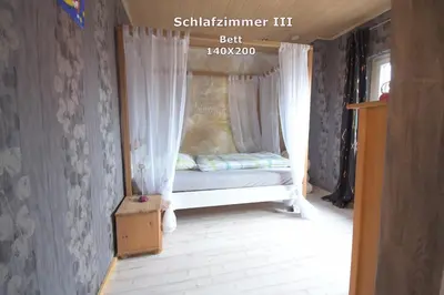 Ein Bett oder Betten in einem Zimmer der Unterkunft Ferienwohnung Haus Willi