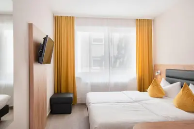 Ein Bett oder Betten in einem Zimmer der Unterkunft Hotel Gute Hoffnung Pforzheim