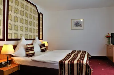 Ein Bett oder Betten in einem Zimmer der Unterkunft Hotel Neckarlux