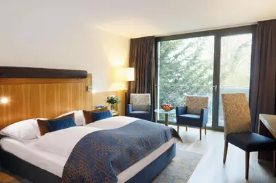 Ein Bett oder Betten in einem Zimmer der Unterkunft FAVORITE Parkhotel I Spa - Business - Fine Dining
