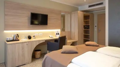 Ein Bett oder Betten in einem Zimmer der Unterkunft Hotel-Restaurant Barbarossahof