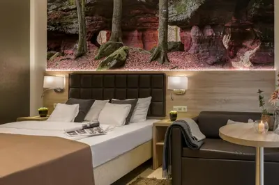 Ein Bett oder Betten in einem Zimmer der Unterkunft Hotel-Restaurant Barbarossahof