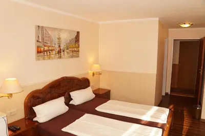 Ein Bett oder Betten in einem Zimmer der Unterkunft Hotel Boos