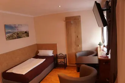 Ein Bett oder Betten in einem Zimmer der Unterkunft Hotel Boos