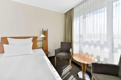 Ein Bett oder Betten in einem Zimmer der Unterkunft NH Mannheim Viernheim