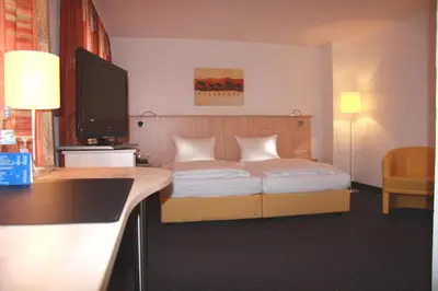 Ein Bett oder Betten in einem Zimmer der Unterkunft Hotel Barth