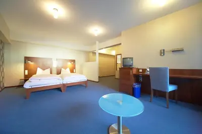 Ein Bett oder Betten in einem Zimmer der Unterkunft Landhotel zum Schwanen mit Restaurant Mona Liza