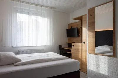 Ein Bett oder Betten in einem Zimmer der Unterkunft Cocco-Bello Smart Check-in Hotel