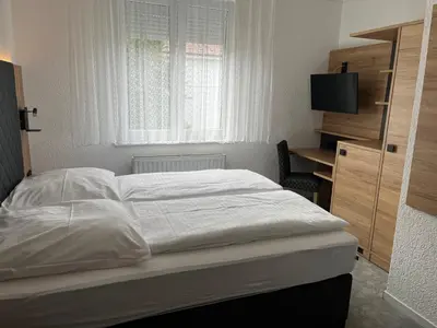 Ein Bett oder Betten in einem Zimmer der Unterkunft Cocco-Bello Smart Check-in Hotel