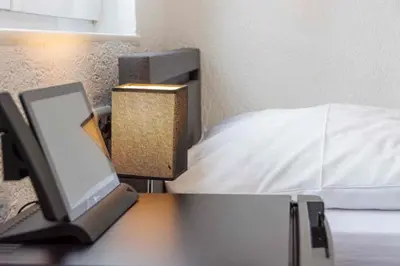 Ein Bett oder Betten in einem Zimmer der Unterkunft Cocco-Bello Smart Check-in Hotel