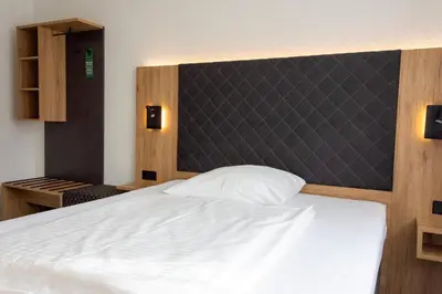 Ein Bett oder Betten in einem Zimmer der Unterkunft Cocco-Bello Smart Check-in Hotel