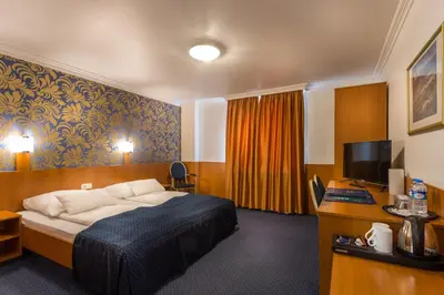 Ein Bett oder Betten in einem Zimmer der Unterkunft Hotel ATLANTA Darmstadt