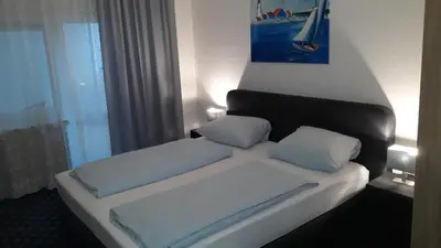 Ein Bett oder Betten in einem Zimmer der Unterkunft Hotel Elsenztal