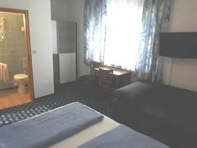 Ein Bett oder Betten in einem Zimmer der Unterkunft Hotel Elsenztal
