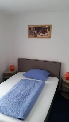 Ein Bett oder Betten in einem Zimmer der Unterkunft Hotel Elsenztal