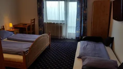 Ein Sitzbereich in der Unterkunft Hotel Elsenztal