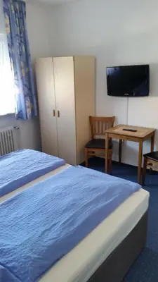 Ein Bett oder Betten in einem Zimmer der Unterkunft Hotel Elsenztal