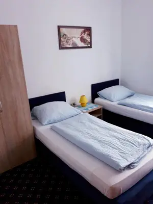 Ein Bett oder Betten in einem Zimmer der Unterkunft Hotel Elsenztal