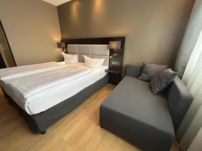 Ein Bett oder Betten in einem Zimmer der Unterkunft Hotel am Karlstor